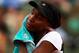 PARIS, FRANCE - MAY 27: Venus Williams of USA wipes her face with a towel during a break in the women's singles first round match betweenVenus Williams of USA and Paula Ormaechea of Argentina on day one of the French Open at Roland Garros on May 27, 2012 in Paris, France. (Photo by Clive Brunskill/Getty Images)