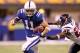 INDIANAPOLIS - NOVEMBER 01: Anthony Gonzalez #11 of Indianapolis Colts runs with the ball while defended by Eugene Wilson #26 of the Houston Texans during the NFL game at Lucas Oil Stadium on November 1, 2010 in Indianapolis, Indiana. (Photo by Andy Lyons/Getty Images)