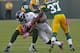 GREEN BAY, WI - OCTOBER 2: Knowshon Moreno #27 of the Denver Broncos gets hit by C.J. Wilson #98 and Sam Shields #37 of the Green Bay Packers at Lambeau Field on October 2, 2011 in Green Bay, Wisconsin. (Photo by Matt Ludtke /Getty Images)