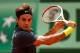 PARIS, FRANCE - MAY 30: Roger Federer of Switzerland plays a backhand during his men's singles second round match against Adrian Ungur of Romania during day four of the French Open at Roland Garros on May 30, 2012 in Paris, France. (Photo by Clive Brunskill/Getty Images)