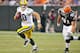 CLEVELAND, OH - AUGUST 13: Brian Schaefering #91 of the Cleveland Browns pursues Matt Flynn #10 of the Green Bay Packers during the second quarter at Cleveland Browns Stadium on August 13, 2011 in Cleveland, Ohio. The Browns defeated the Packers 27-17. (Photo by Jason Miller/Getty Images)