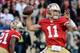 SAN FRANCISCO, CA - JANUARY 14: Alex Smith #11 of the San Francisco 49ers looks to pass from the pocket during the NFC Divisional playoff game against the New Orleans Saints at Candlestick Park on January 14, 2012 in San Francisco, California. (Photo by Thearon W. Henderson/Getty Images)