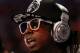 ORLANDO, FL - FEBRUARY 26: Hip-hop artists Lil' Wayne, wearing diamond studded beats headphones by Dr. Dre sits courtside during the 2012 NBA All-Star Game at the Amway Center on February 26, 2012 in Orlando, Florida. NOTE TO USER: User expressly acknowledges and agrees that, by downloading and or using this photograph, User is consenting to the terms and conditions of the Getty Images License Agreement. (Photo by Ronald Martinez/Getty Images)