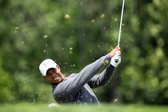 Tiger is three back of the leader Spencer Levin