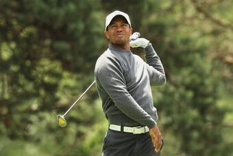 Tiger fanned his drive right into the trees at No. 15