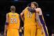LOS ANGELES, CA - MAY 12: (R-L) Pau Gasol #16 hugs teammate Andrew Bynum #17 of the Los Angeles Lakers in the fourth quarter alongside Kobe Bryant #24 while taking on the Denver Nuggets in Game Seven of the Western Conference Quarterfinals in the 2012 NBA Playoffs on May 12, 2012 at Staples Center in Los Angeles, California. NOTE TO USER: User expressly acknowledges and agrees that, by downloading and or using this photograph, User is consenting to the terms and conditions of the Getty Images License Agreement. (Photo by Harry How/Getty Images)