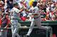 BOSTON, MA - MAY 28: Delmon Young #21 of the Detroit Tigers celebrates his home run with Gene Lamont #22 of the Detroit Tigers in the second inning at Fenway Park May 28, 2012 in Boston, Massachusetts. (Photo by Jim Rogash/Getty Images)