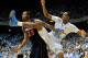 CHAPEL HILL, NC - FEBRUARY 11: John Henson #31 of the North Carolina Tar Heels follows through after a 3-point attempt over Mike Scott #23 of the Virginia Cavaliers during play at the Dean Smith Center on February 11, 2012 in Chapel Hill, North Carolina. North Carolina won 70-52. (Photo by Grant Halverson/Getty Images)