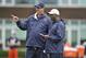 LAKE FOREST, IL - MAY 12: Offensive coordinator Mike Tice (L) and head coach Lovie Smith of the Chicago Bears stand on the field during rookie minicamp at Halas Hall on May 12, 2012 in Chicago, Illinois. (Photo by Brian Kersey/Getty Images)