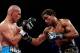 NEW YORK, NY - DECEMBER 03: Mike Jones (R) of the United States connects with a right handed punch against Sebastian Lujan of Argentina during their IBF Eliminator, NABA & NABO Welterweight Title fight at Madison Square Garden on December 3, 2011 in New York City. (Photo by Al Bello/Getty Images)
