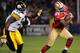 SAN FRANCISCO, CA - DECEMBER 19: Frank Gore #21 of the San Francisco 49ers rushes for thirteen yards out running Lawrence Timmons #94 of the Pittsburgh Steelers at Candlestick Park on December 19, 2011 in San Francisco, California. (Photo by Thearon W. Henderson/Getty Images)