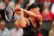 PARIS, FRANCE - JUNE 06: Maria Sharapova of Russia plays a backhand in her women's singles quarter final match against Kaia Kanepi of Estonia during day 11 of the French Open at Roland Garros on June 6, 2012 in Paris, France. (Photo by Mike Hewitt/Getty Images)