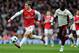 LONDON, ENGLAND - MARCH 05: Jack Wilshere of Arsenal is pursued by Sulley Muntari of Sunderland during the Barclays Premier League match between Arsenal and Sunderland at Emirates Stadium on March 5, 2011 in London, England. (Photo by Mike Hewitt/Getty Images)