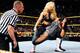 Natalya stretches Tamina (image courtesy of WWE.com)