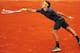 PARIS, FRANCE - JUNE 05: Roger Federer of Switzerland plays a forehand in his men's singles quarter final match against Juan Martin Del Potro of Argentina during day 10 of the French Open at Roland Garros on June 5, 2012 in Paris, France. (Photo by Mike Hewitt/Getty Images)