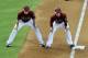 PHOENIX, AZ - JUNE 06: Aaron Hill #2 and third base coach Matt Williams #9 of the Arizona Diamondbacks look in to home plate from third base against the Colorado Rockies at Chase Field on June 6, 2012 in Phoenix, Arizona. Arizona won 6-1. (Photo by Norm Hall/Getty Images)