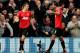 LONDON, ENGLAND - DECEMBER 18: Michael Carrick (L) of Manchester United is congratulated by teammate Rio Ferdinand after scoring his team's second goal during the Barclays Premier League match between Queens Park Rangers and Manchester United at Loftus Road on December 18, 2011 in London, England. (Photo by Scott Heavey/Getty Images)