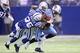 INDIANAPOLIS, IN - DECEMBER 18: Chris Johnson #28 of the Tennessee Titans runs with the ball while tackled by Chris Rucker #36 of the Indianapolis Colts during the NFL game against at Lucas Oil Stadium on December 18, 2011 in Indianapolis, Indiana. (Photo by Andy Lyons/Getty Images)
