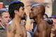 LAS VEGAS, NV - JUNE 08: Boxers Manny Pacquiao (L) and Timothy Bradley pose during the official weigh-in for their bout at the MGM Grand Garden Arena on June 8, 2012 in Las Vegas, Nevada. Pacquiao will defend his WBO welterweight title against Bradley on June 9 in Las Vegas. (Photo by Kevork Djansezian/Getty Images)