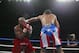 SAN JUAN - MAY 11 : Diobelys Hurtado (L) takes a jab to the face from Randall Bailey during the WBA Super Lightweight Championship bout at Roberto Clemente Coliseum in San Juan, Puerto Rico on May 11, 2002. Hurtado defeats Bailey through TKO in round 7. (Photo by Al Bello/Getty Images)