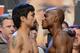 LAS VEGAS, NV - JUNE 08: Boxers Manny Pacquiao (L) and Timothy Bradley pose during the official weigh-in for their bout at the MGM Grand Garden Arena on June 8, 2012 in Las Vegas, Nevada. Pacquiao will defend his WBO welterweight title against Bradley on June 9 in Las Vegas. (Photo by Kevork Djansezian/Getty Images)