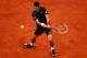 PARIS, FRANCE - JUNE 10: Novak Djokovic of Serbia plays a backhand during the men's singles final against Rafael Nadal of Spain on day 15 of the French Open at Roland Garros on June 10, 2012 in Paris, France. (Photo by Clive Brunskill/Getty Images)