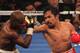 LAS VEGAS, NV - JUNE 09: (R-L) Manny Pacquiao lands a right to the head of Timothy Bradley during their WBO welterweight title fight at MGM Grand Garden Arena on June 9, 2012 in Las Vegas, Nevada. (Photo by Jeff Bottari/Getty Images)