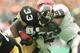6 JAN 1996: RUNNING BACK BYRON 'BAM' MORRIS #33 OF THE PITTSBURGH STEELERS POWERS INTO THE ENDZONE FOR A TOUCHDOWN DESPITE THE ATTEMPTED TACKLE BY LINEBACKER MONTY BROWN #96 OF THE BUFFALO BILLS DURING THE FOURTH QUARTER OF THE STEELERS'' 40-21 AFC PLAYOF