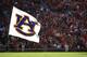 AUBURN - OCTOBER 16: An Auburn cheerleader runs in the end zone with the Auburn flag after a touchdown during the game between the Arkansas Razorbacks and the Auburn Tigers at Jordan-Hare Stadium on October 16, 2010 in Auburn, Alabama. (Photo by Mike Zarrilli/Getty Images)