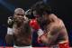LAS VEGAS, NV - JUNE 09: (L-R) Timothy Bradley lands a left to the head of Manny Pacquiao during their WBO welterweight title fight at MGM Grand Garden Arena on June 9, 2012 in Las Vegas, Nevada. (Photo by Kevork Djansezian/Getty Images)
