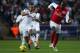 SWANSEA, WALES - JANUARY 15: Scott Sinclair of Swansea City takes on Johan Djourou of Arsenal during the Barclays Premier League match between Swansea City and Arsenal at Liberty Stadium on January 15, 2012 in Swansea, Wales. (Photo by Michael Steele/Getty Images)