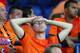KHARKOV, UKRAINE - JUNE 09: Dutch fans look dejected at the final whistle the UEFA EURO 2012 group B match between Netherlands and Denmark at Metalist Stadium on June 9, 2012 in Kharkov, Ukraine. (Photo by Julian Finney/Getty Images)
