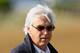 BALTIMORE, MD - MAY 17: Bob Baffert, trainer of Bodemeister, watches his horse train in preparation for the 137th Preakness Stakes at Pimlico Race Course on May 17, 2012 in Baltimore, Maryland. (Photo by Rob Carr/Getty Images)