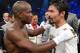 LAS VEGAS, NV - JUNE 09: (L-R) Timothy Bradley and Manny Pacquiao talk in the ring after Bradley defeated Pacquiao by split decision to win the WBO welterweight championship at MGM Grand Garden Arena on June 9, 2012 in Las Vegas, Nevada. (Photo by Kevork Djansezian/Getty Images)