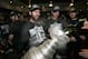 LOS ANGELES, CA - JUNE 11: (L-R) Mike Richards #10, Kyle Clifford #13 and Jonathan Quick #32 of the Los Angeles Kings celebrate with the Stanley Cup in the locker room after the Los Angeles Kings defeated the New Jersey Devils 6-1 in Game Six of the 2012 Stanley Cup Final at the Staples Center on June 11, 2012 in Los Angeles, California. The Kings won the series 4-2. (Photo by Dave Sandford/NHLI/ Pool/Getty Images)