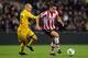 EINDHOVEN, NETHERLANDS - MARCH 31: Kevin Strootman of PSV and Ismo Vorstermans of Venlo battle for the ball during the Eredivisie match between PSV Eindhoven v VVV Venlo at Philips Stadion on March 31, 2012 in Eindhoven, Netherlands. (Photo by Dean Mouhtaropoulos/Getty Images)