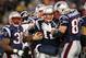 FOXBORO, MA - JANUARY 22: Tom Brady #12 of the New England Patriots celebrates with his teammates after scoring a touchdown in the fourth quarter against the Baltimore Ravens during their AFC Championship Game at Gillette Stadium on January 22, 2012 in Foxboro, Massachusetts. (Photo by Jim Rogash/Getty Images)