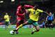 NORWICH, ENGLAND - APRIL 28: Luis Suarez of Liverpool is tackled by Kyle Naughton of Norwich during the Barclays Premier League match between Norwich City and Liverpool at Carrow Road on April 28, 2012 in Norwich, England. (Photo by Jamie McDonald/Getty Images)