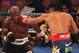 LAS VEGAS, NV - JUNE 09: (R-L) Manny Pacquiao lands a left to the head of Timothy Bradley during their WBO welterweight title fight at MGM Grand Garden Arena on June 9, 2012 in Las Vegas, Nevada. (Photo by Jeff Bottari/Getty Images)