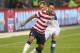 TORONTO, CANADA - JUNE 3: Clint Dempsey #8 of USA dribbles the ball as Kevin McKenna #4 of Canada challenges him during their international friendly match on June 3, 2012 at BMO Field in Toronto, Ontario, Canada. (Photo by Tom Szczerbowski/Getty Images)