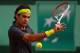PARIS, FRANCE - JUNE 08: Roger Federer of Switzerland plays a backhand in his men's singles semi final match against Novak Djokovic of Serbia during day 13 of the French Open at Roland Garros on June 8, 2012 in Paris, France. (Photo by Clive Brunskill/Getty Images)