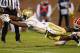 ATLANTA, GA - OCTOBER 29: David Sims #7 of the Georgia Tech Yellow Jackets dives for a touchdown against Jonathan Meeks #5 of the Clemson Tigers at Bobby Dodd Stadium on October 29, 2011 in Atlanta, Georgia. (Photo by Kevin C. Cox/Getty Images)