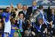 MUNICH, GERMANY - MAY 19: Club owner Roman Abramovich (R) lifts the trophy in celebration while Chancellor of the Exchequer George Osborne (C) applauds after their victory in the UEFA Champions League Final between FC Bayern Muenchen and Chelsea at the Fussball Arena München on May 19, 2012 in Munich, Germany. (Photo by Mike Hewitt/Getty Images)