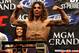 Clay Guida stands on the scale, sporting his trademark shoulder-length hair. (Photo: MMAjunkie.com)