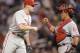 MINNEAPOLIS, MN - JUNE 13: Jonathan Papelbon #58 and Carlos Ruiz #51 of the Philadelphia Phillies celebrate a win against the Minnesota Twins on June 13, 2012 at Target Field in Minneapolis, Minnesota. The Phillies defeated the Twins 9-8. (Photo by Hannah Foslien/Getty Images)