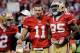 SAN FRANCISCO, CA - JANUARY 14: David Akers #2, Alex Smith #11 and Vernon Davis #85 of the San Francisco 49ers celebrate after winning the NFC Divisional playoff game 36-32 over the New Orleans Saints at Candlestick Park on January 14, 2012 in San Francisco, California. (Photo by Thearon W. Henderson/Getty Images)
