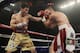 HOUSTON - NOVEMBER 19: Julio Chavez Jr., left, connects with a jab to the face of Peter Manfredo Jr. during their World Middleweight Championship fight at Reliant Arena at Reliant Park on November 19, 2011 in Houston, Texas. Chavez retained his belt with a fifth round TKO. (Photo by Bob Levey/Getty Images)