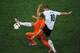 KHARKOV, UKRAINE - JUNE 13: Arjen Robben of Netherlands competes for the ball with Lukas Podolski of Germany during the UEFA EURO 2012 group B match between Netherlands and Germany at Metalist Stadium on June 13, 2012 in Kharkov, Ukraine. (Photo by Christopher Lee/Getty Images)