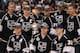 LOS ANGELES, CA - JUNE 14: (L-R) Jeff Carter #77, Anze Kopitar #11, Kevin Westgarth #19, captain Dustin Brown #23, Colin Fraser #24, Mike Richards #10, Brad Richardson #15, Jonathan Quick #32, Dustin Penner #25 Alec Martinez #27 and Trevor Lewis #22 of the Los Angeles Kings stand with the Stanley Cup during the rally in Staples Center after the Los Angeles Kings Stanley Cup Victory Parade on June 14, 2012 in Los Angeles, California. (Photo by Victor Decolongon/Getty Images)