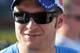 Dale Earnhardt Jr. smiling in Charlotte Motor Speedway before winning in Michigan. Credit: David Yeazell